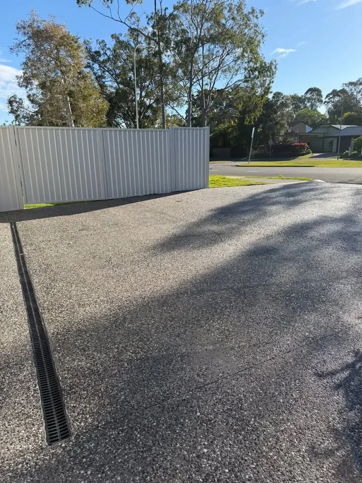 Exposed aggregate driveway with a grated drain