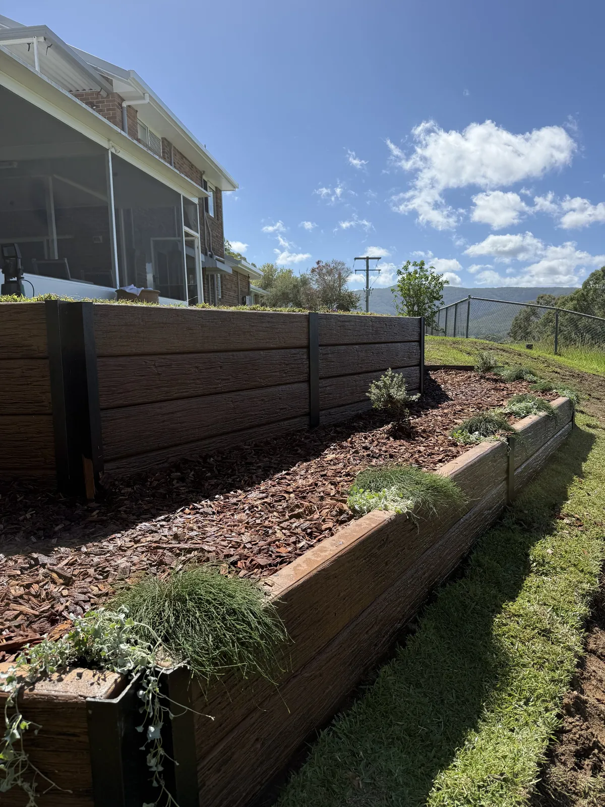 Timber retaining wall on a sloping yard
